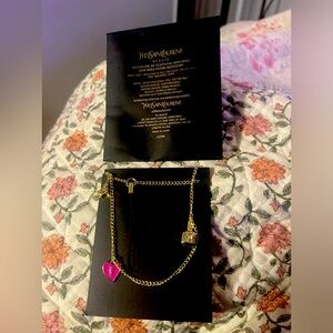Yves Saint Laurent phone charm